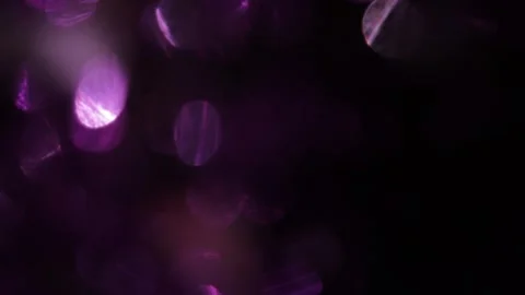 Abstract background of glowing purple bokeh light effect, very slow motion Видео 318945000
