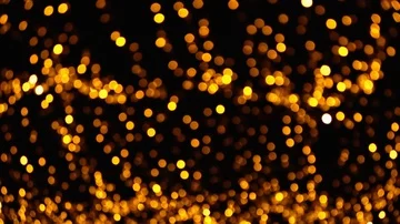 Abstract background of gold bokeh lights. Panning from bottom to top Stock Footage 85483278