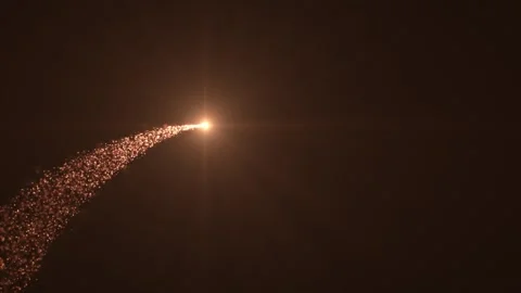 Abstract background of gold particles. Particles swirl and fly with a trail. Stock Footage 276951380