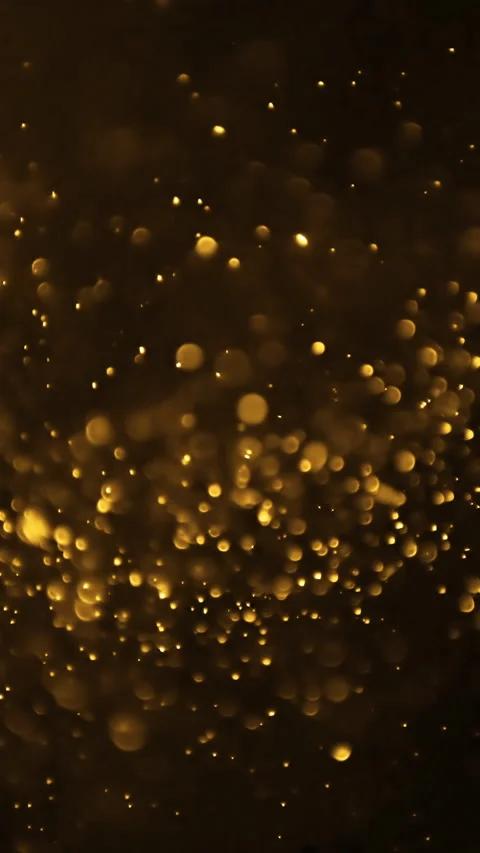 Abstract background with golden glittering particles in motion. Vertical video. Stock Footage 270211105