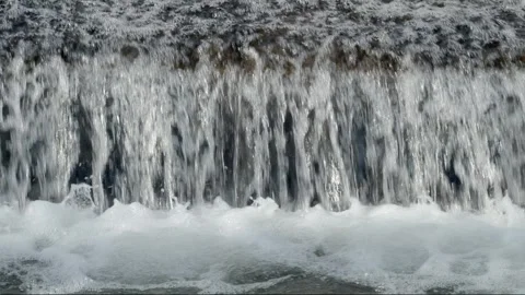 Abstract background, Graphic elements, Bubbling water flows quickly over a weir, Stock Footage 298082223
