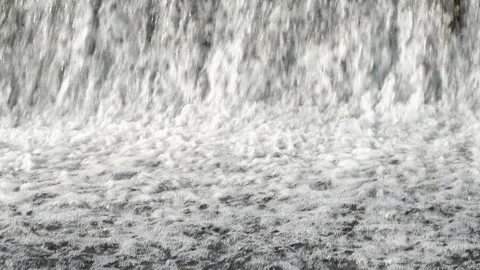 Abstract background, Graphic elements, Bubbling water flows quickly over a weir, Stock Footage 298083924