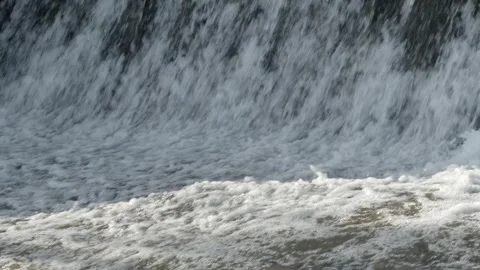 Abstract background, Graphic elements, Bubbling water flows quickly over a weir, Stock Footage 298084868