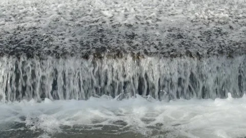 Abstract background, Graphic elements, Bubbling water flows quickly over a weir, Stock Footage 298084892