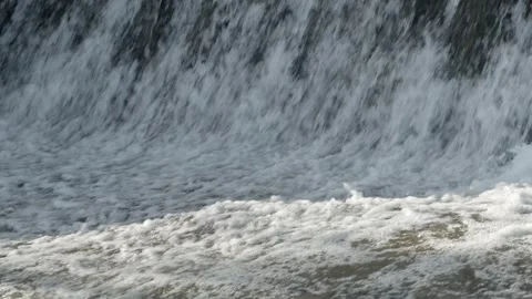 Abstract background, Graphic elements, Bubbling water flows quickly over a weir, Stock Footage 298085288