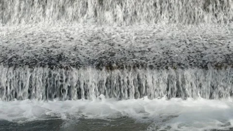 Abstract background, Graphic elements, Bubbling water flows quickly over a weir, Stock Footage 298085508