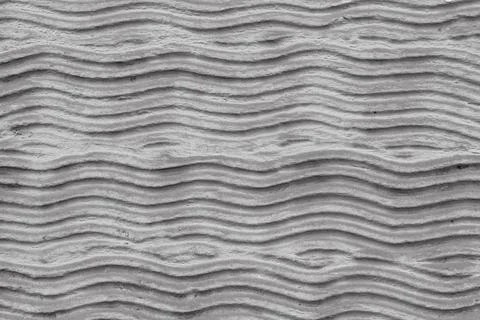 Abstract background with gray wavy cement pattern. Decorative wave texture Foto stock
