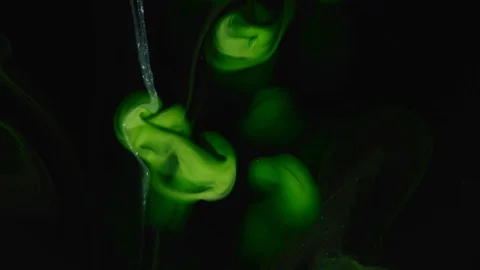 Abstract background. Green emerald paint mixing in black water Stock Footage 89811800
