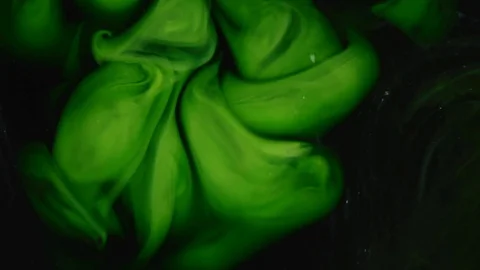 Abstract background. Green emerald paint mixing in black water Stockbeeldmateriaal 89811837