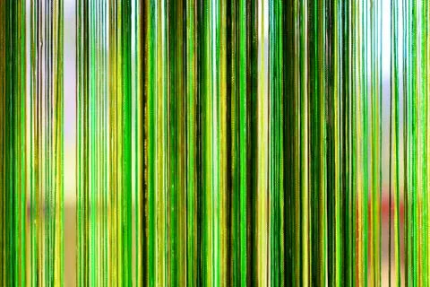 Abstract background - greenish strings behind the glass 写真素材