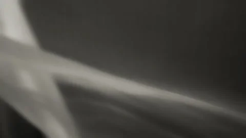 Abstract background of grey chiffon textile waving in the wind Stock Footage 293638481