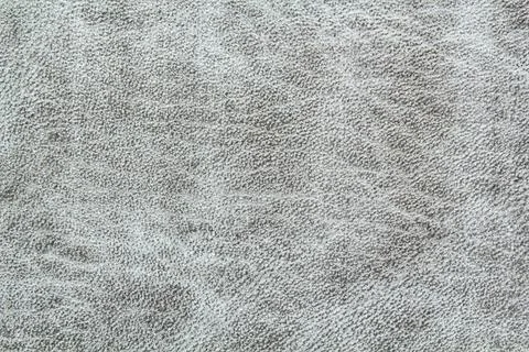 Abstract background of grey glossy artificial genuine textured creased leather Stock Photos