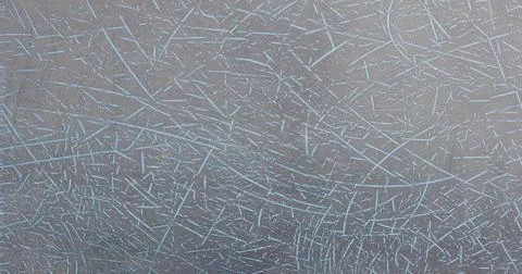 Abstract Background of Grey Surface with Light Blue Scratch Pattern Stock Photos