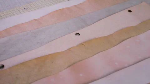 Abstract background of handmade paper sheets dyed with natural vegetable pigment Stock Footage 330270311