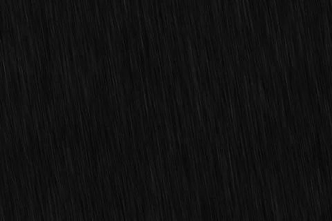 Abstract background of heavy rain falling diagonally on a dark background. .. Stock Photos