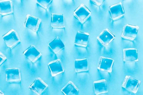 Abstract background with ice cubes on blue background, flat lay Stock Photos
