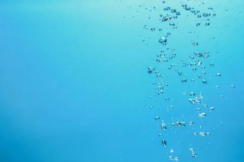 Abstract background image of bubbles in blue water. Stock Photos