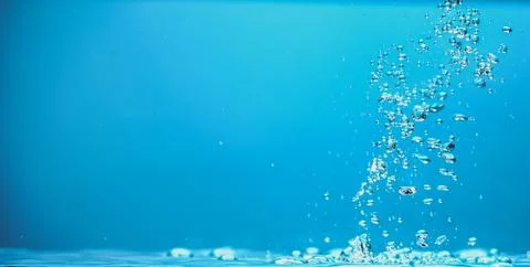 Abstract background image of bubbles in blue water. Stock Photos