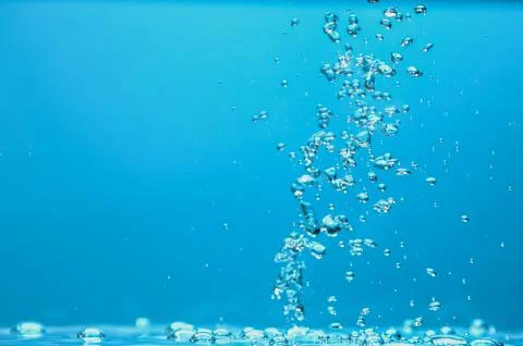 Abstract background image of bubbles in blue water. Stock Photos