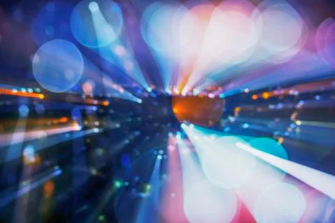 Abstract background image of circular bokeh motion blurred street light backg Stock Photos