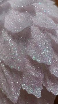 Abstract background of layered soft pink texture covered with vibrant iride.. Stock Photos