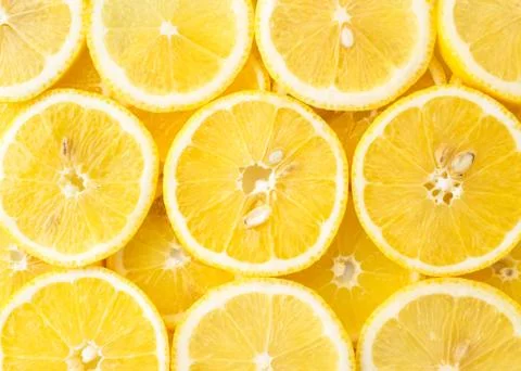Abstract background of lemon slices top view. Stock Photos