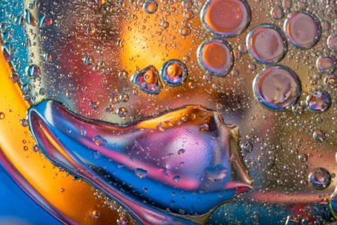 Abstract background in lilac tones with oily drops Stock Photos