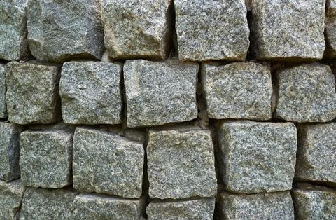 Abstract background of lined wall of granite stones of square shape. 스톡 사진