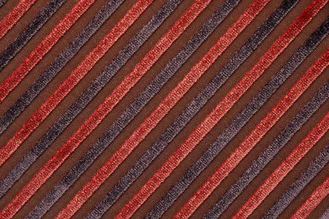 Abstract background with lines pattern, Velvet dark red fabric surface, stripes Stock Photos