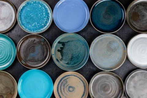 Abstract background made of decorative empty round ceramic dishes different c 스톡 사진