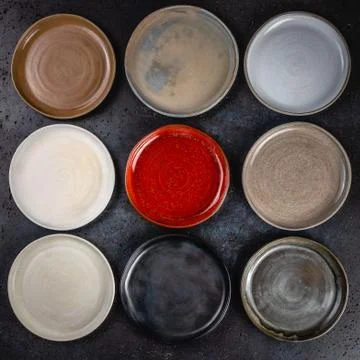 Abstract background made of decorative empty round ceramic dishes different c 库存照片