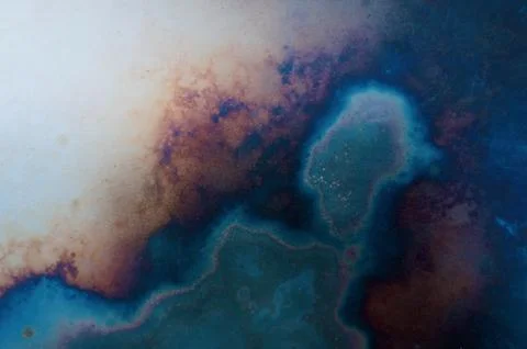Abstract background of a metal surface after exposure to temperature Stock Photos