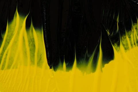 An abstract background of mixed black and yellow acrylic paint with a glossy  Stock Illustration