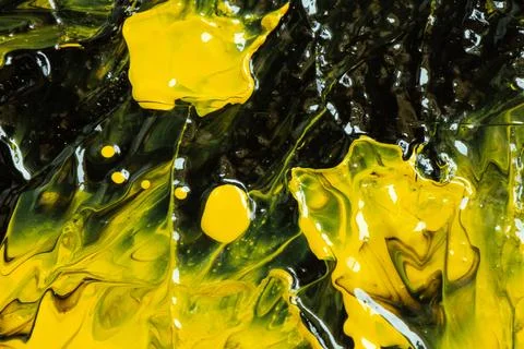 An abstract background of mixed black and yellow acrylic paint with a gloss.. Stock Illustration