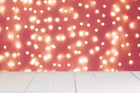 Abstract background, mockup. Defocused red lights bokeh and white wooden su.. Stock Photos