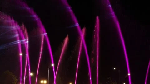 Abstract background. Motion blurred colorful fountain at night Stock Footage 316446789
