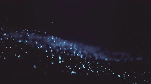 Abstract background with moving and flickering particles. A moving wave of deep Stock Footage 133396625