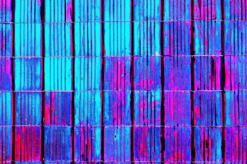 Abstract background of multi-colored stripes on ceramic tiles on the wall, .. Stock Photos