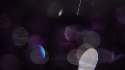 Abstract background of multicolored sparkling bokeh lights on black Видео 318944552
