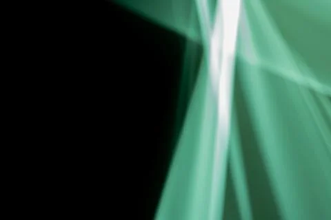 Abstract background, neon green rays on black. Stock Illustration
