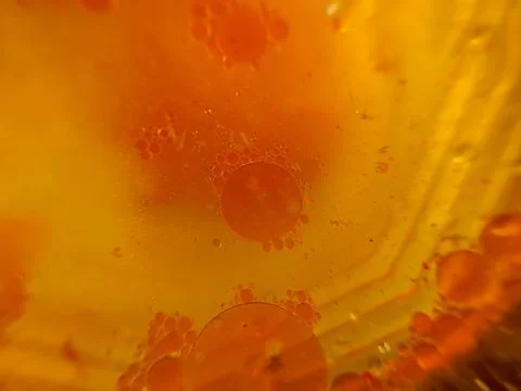 Abstract background of oil liquid floating on the surface of water Фото