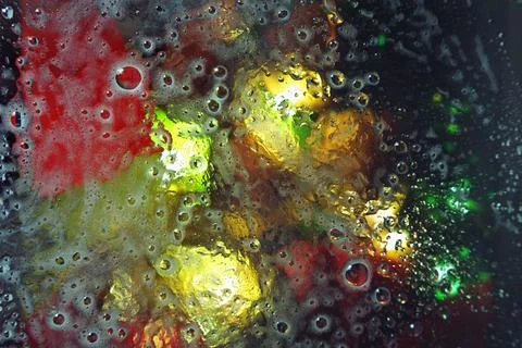 Abstract background of oil stains on the surface of water on a bright color.. Stock Photos