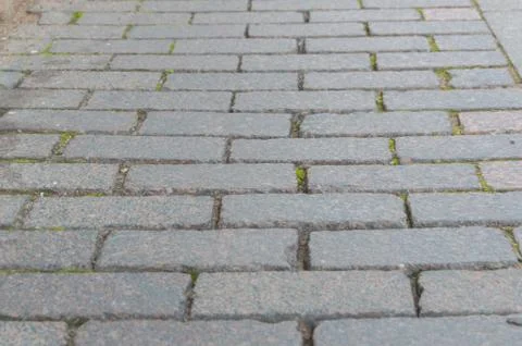 Abstract background of old cobblestone pavement close-up 库存照片