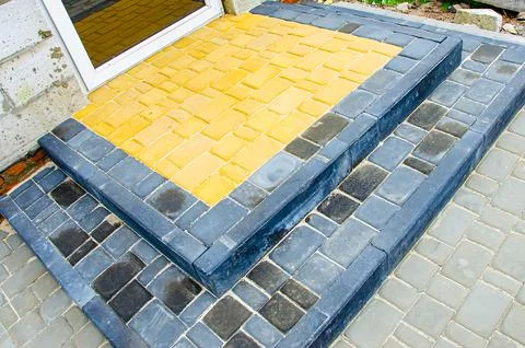 Abstract background of old cobblestone pavement close-up. Stock Photos