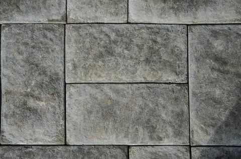 Abstract background of old cobblestone pavement close-up. Stock Photos
