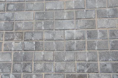 Abstract background of old cobblestone pavement close-up. Stock Photos