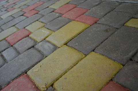 Abstract background of old cobblestone pavement close-up. Stock Photos
