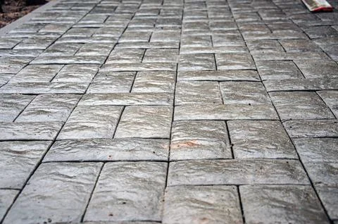 Abstract background of old cobblestone pavement close-up. Stock-Fotos