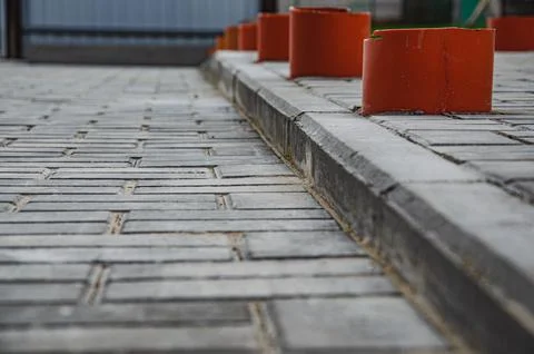 Abstract background of old cobblestone pavement close-up. Stock Photos