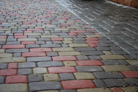 Abstract background. Old cobblestone pavement close-up. City Stock Photos